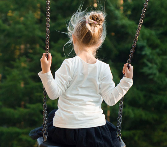 Child on a swing.